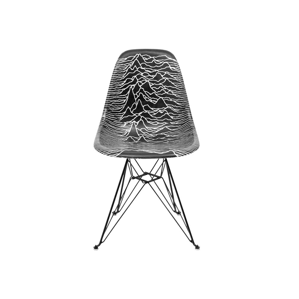 A black Modernica shell chair with Unknown Pleasures pulse lines covering its back and seat