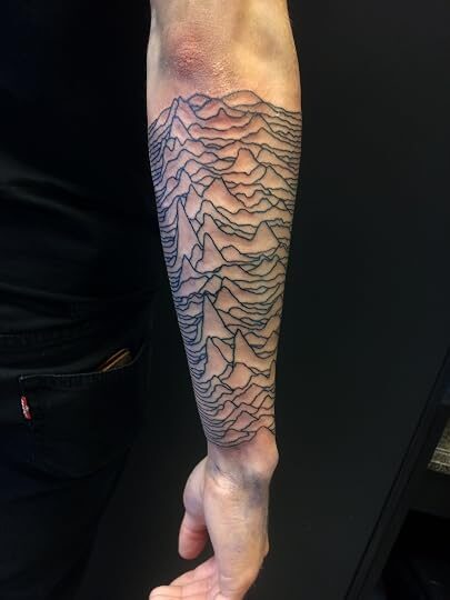 Pulsar and lyric forearm tattoo by Tim Lebron — reference image from Goodreads