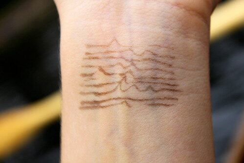 Small pulse-stack wrist tattoo — reference image from Flickr