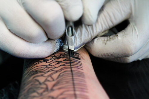 Unknown Pleasures tattoo in progress at Epic Ink — reference image from Flickr